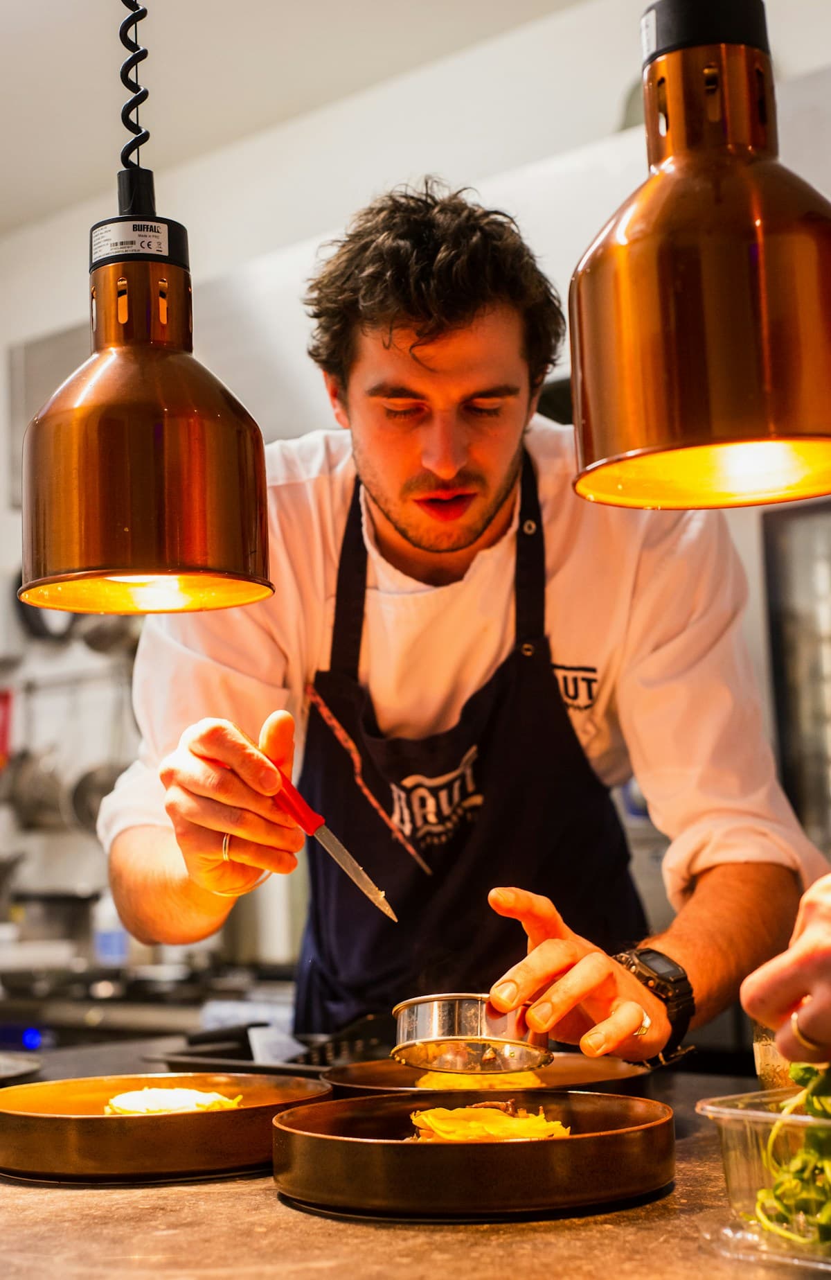 Culinary chef plating with care